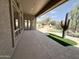 Covered patio overlooking the pool and backyard landscaping. Perfect for outdoor entertaining! at 6931 E Teton Cir, Mesa, AZ 85207