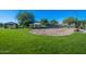 Well-maintained community playground with swings and covered picnic area at 6931 E Teton Cir, Mesa, AZ 85207