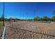 Community sand volleyball court and basketball court on a sunny day at 6931 E Teton Cir, Mesa, AZ 85207