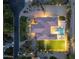 Aerial view of luxurious home featuring pool, sport court, mature landscaping and circular driveway at 7129 E Caron Dr, Paradise Valley, AZ 85253
