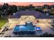 Aerial view of backyard featuring a pool, spa, and fire pit, creating an inviting outdoor living space at 7129 E Caron Dr, Paradise Valley, AZ 85253
