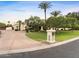 Well maintained home exterior showcasing desert landscaping, mature trees, and a private driveway at 7129 E Caron Dr, Paradise Valley, AZ 85253