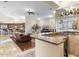 Open-concept living room and kitchen with a wet bar area, perfect for entertaining guests at 7129 E Caron Dr, Paradise Valley, AZ 85253