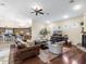 Spacious living room with hardwood floors and an adjacent kitchen, perfect for entertaining at 7129 E Caron Dr, Paradise Valley, AZ 85253