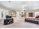 Spacious main bedroom with sitting area, fireplace and chandelier, offering a relaxing retreat at 7129 E Caron Dr, Paradise Valley, AZ 85253