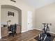 Bright office space featuring a built-in desk, wood floors, and natural light perfect for working from home or exercise at 7129 E Caron Dr, Paradise Valley, AZ 85253