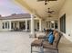 Expansive covered patio with ceiling fans, perfect for outdoor dining and relaxation at 7129 E Caron Dr, Paradise Valley, AZ 85253