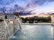 Tranquil backyard with waterfalls flowing into a serene pool, creating a peaceful retreat at 7129 E Caron Dr, Paradise Valley, AZ 85253