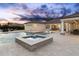 Backyard with sparkling pool, integrated spa, and ample patio space for entertaining guests at 7129 E Caron Dr, Paradise Valley, AZ 85253