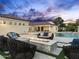 Backyard oasis with pool, spa, fire pit, and lounge seating, ideal for relaxation and entertaining at 7129 E Caron Dr, Paradise Valley, AZ 85253