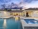 Spacious backyard with a sparkling pool, spa, and covered patio, offering luxurious outdoor living at 7129 E Caron Dr, Paradise Valley, AZ 85253