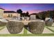 Inviting poolside seating area with a fire pit, perfect for relaxing evenings by the pool at 7129 E Caron Dr, Paradise Valley, AZ 85253