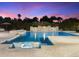 Beautiful swimming pool with chaise lounges, waterfall feature, and lush landscaping at 7129 E Caron Dr, Paradise Valley, AZ 85253