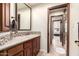 Traditional bathroom featuring granite countertops and mosaic tile accent at 7475 E Gainey Ranch Rd # 4, Scottsdale, AZ 85258