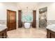 Luxurious bathroom featuring a soaking tub, glass shower, and stylish dark wood cabinets at 7475 E Gainey Ranch Rd # 4, Scottsdale, AZ 85258