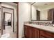 Neutral-toned bathroom featuring mosaic tile accent and granite countertops at 7475 E Gainey Ranch Rd # 4, Scottsdale, AZ 85258