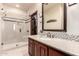 Full bathroom featuring granite countertop, glass shower, and tile accent at 7475 E Gainey Ranch Rd # 4, Scottsdale, AZ 85258