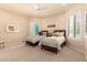 Shared bedroom featuring twin beds, carpeted floors, and natural lighting at 7475 E Gainey Ranch Rd # 4, Scottsdale, AZ 85258