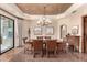 Traditional dining room with trey ceilings, decorative lighting, and large windows to let in plenty of natural light at 7475 E Gainey Ranch Rd # 4, Scottsdale, AZ 85258