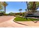 Welcoming community entrance with manicured landscaping and a decorative stone sign at 7475 E Gainey Ranch Rd # 4, Scottsdale, AZ 85258