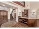 Elegant entryway leading to a staircase and built-in bar area with granite countertops, perfect for entertaining at 7475 E Gainey Ranch Rd # 4, Scottsdale, AZ 85258