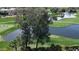 Scenic golf course view with lush green fairways, water hazards, and mature trees at 7475 E Gainey Ranch Rd # 4, Scottsdale, AZ 85258