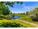 Picturesque view of a lush golf course with a tranquil lake and meticulously manicured greenery at 7475 E Gainey Ranch Rd # 4, Scottsdale, AZ 85258