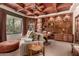 Open living room featuring hardwood accents, recessed lighting, and built-in bookcase at 7475 E Gainey Ranch Rd # 4, Scottsdale, AZ 85258