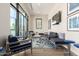 Comfortable resident lounge with plenty of seating, natural light, and a TV for relaxation and socializing at 7475 E Gainey Ranch Rd # 4, Scottsdale, AZ 85258