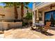 Stone patio featuring outdoor kitchen and desert landscaping at 7475 E Gainey Ranch Rd # 4, Scottsdale, AZ 85258