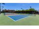 Well-lit pickleball courts with vibrant blue surfaces and green surroundings, perfect for recreation at 7475 E Gainey Ranch Rd # 4, Scottsdale, AZ 85258