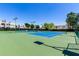 Spacious pickleball courts with vibrant surfaces, surrounded by lush greenery and community buildings at 7475 E Gainey Ranch Rd # 4, Scottsdale, AZ 85258