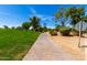 Scenic walking path surrounded by green lawns, mature trees and manicured landscaping at 7475 E Gainey Ranch Rd # 4, Scottsdale, AZ 85258