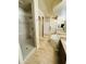 Bright bathroom highlighting tile flooring, walk-in glass shower and dual sink vanities at 7601 E Indian Bend Rd # 1049, Scottsdale, AZ 85250