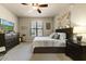 Cozy bedroom with a ceiling fan, a window with blinds, and art pieces at 7601 E Indian Bend Rd # 1049, Scottsdale, AZ 85250