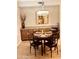Dining area featuring an elegant light fixture and a stylish table setting at 7601 E Indian Bend Rd # 1049, Scottsdale, AZ 85250