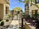 Enclosed dog park with secure gate and landscaping, offers residents pet-friendly amenities at 7601 E Indian Bend Rd # 1049, Scottsdale, AZ 85250