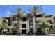 Attractive condominium building with palm trees, balconies, and a well-maintained facade at 7601 E Indian Bend Rd # 1049, Scottsdale, AZ 85250
