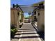 Outdoor grilling area featuring pergola, BBQ, and green space for community residents at 7601 E Indian Bend Rd # 1049, Scottsdale, AZ 85250
