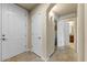 Bright hallway features tile floors, neutral walls, and access to multiple rooms at 7601 E Indian Bend Rd # 1049, Scottsdale, AZ 85250