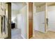 Hallway with access to the bedroom with a sliding barn door and various storage spaces at 7601 E Indian Bend Rd # 1049, Scottsdale, AZ 85250