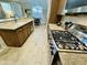 Well-lit kitchen featuring granite countertops, stainless steel appliances, and wood cabinets at 7601 E Indian Bend Rd # 1049, Scottsdale, AZ 85250