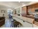 Kitchen island with breakfast bar seating, providing a casual dining option and additional counter space at 7601 E Indian Bend Rd # 1049, Scottsdale, AZ 85250