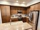 Modern kitchen featuring stainless steel appliances, granite countertops and updated cabinetry at 7601 E Indian Bend Rd # 1049, Scottsdale, AZ 85250