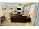 Cozy living room with a fireplace, comfortable seating, and lots of natural light at 7601 E Indian Bend Rd # 1049, Scottsdale, AZ 85250