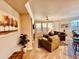 Bright living room with large windows, tile flooring, and a decorative fireplace at 7601 E Indian Bend Rd # 1049, Scottsdale, AZ 85250