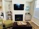 Relaxing living room with a fireplace, ample seating, and contemporary decor at 7601 E Indian Bend Rd # 1049, Scottsdale, AZ 85250
