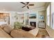 Cozy living room with fireplace, comfortable seating, and a flat-screen TV, creating a welcoming atmosphere at 7601 E Indian Bend Rd # 1049, Scottsdale, AZ 85250