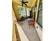 Outdoor patio with ceiling fan, table and chairs overlooking a landscaped yard at 7601 E Indian Bend Rd # 1049, Scottsdale, AZ 85250
