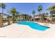 Beautiful community pool with lounge chairs and lush landscaping at 7601 E Indian Bend Rd # 1049, Scottsdale, AZ 85250